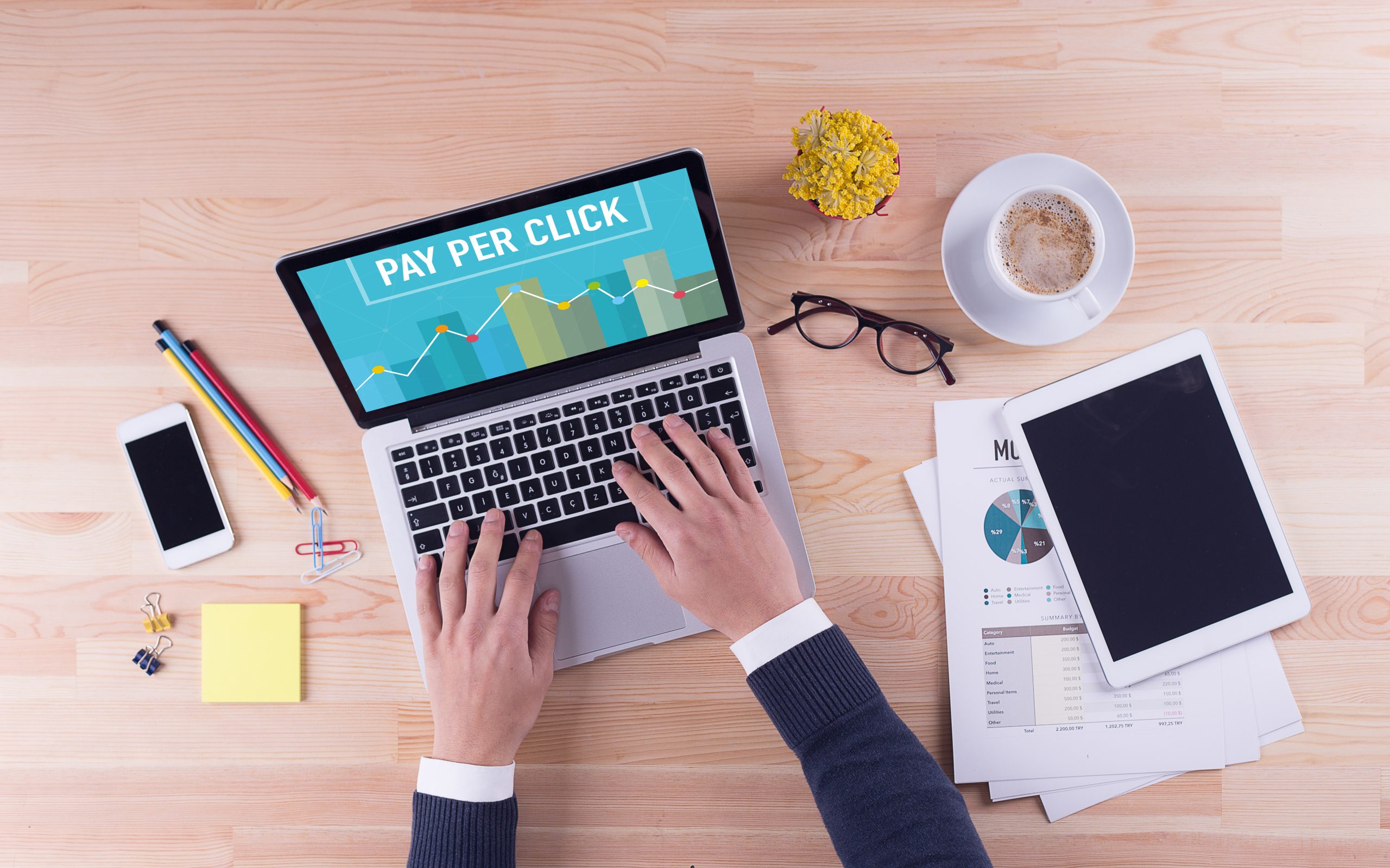 Businessman is working on laptop with - PAY PER CLICK on the screen
